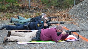 Sergeant Herrera, Officer Vestri, and Officer Smith take aim from a distance during firearms training.